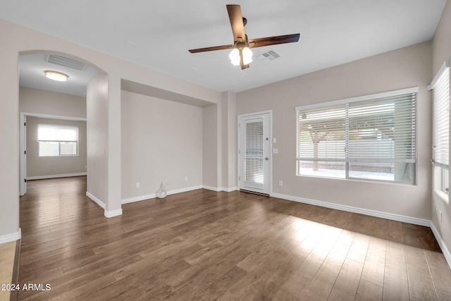 unfurnished room with hardwood / wood-style flooring and ceiling fan