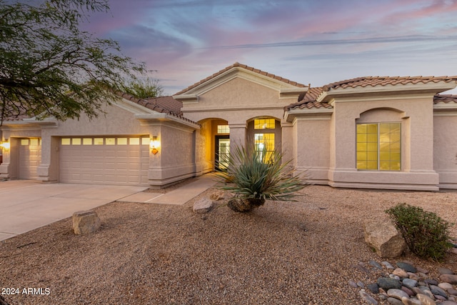 view of front of home with a garage