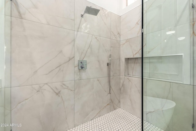 full bathroom with a marble finish shower