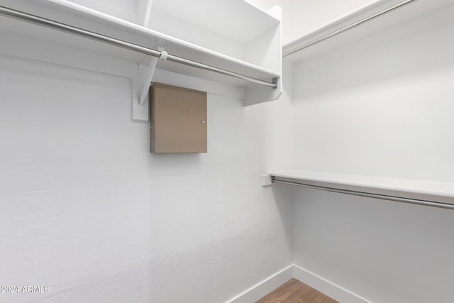 walk in closet featuring wood finished floors