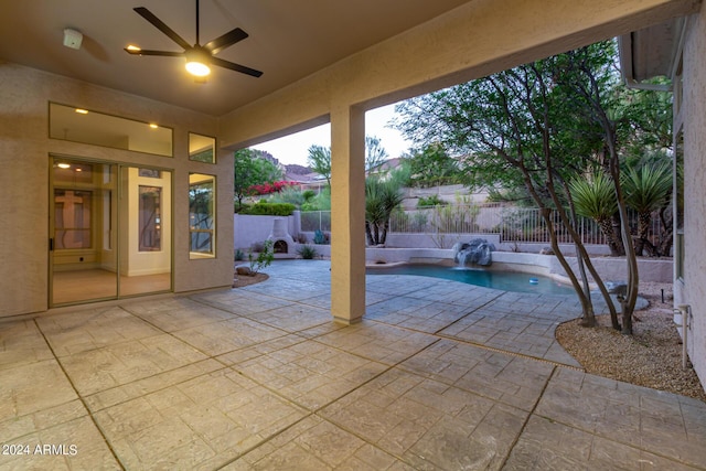 view of patio / terrace with a fenced in pool, a ceiling fan, and a fenced backyard