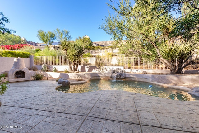 view of pool with a patio, a fenced in pool, and a fenced backyard