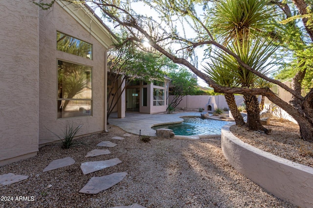 view of swimming pool with a patio area, a fenced backyard, and a fenced in pool