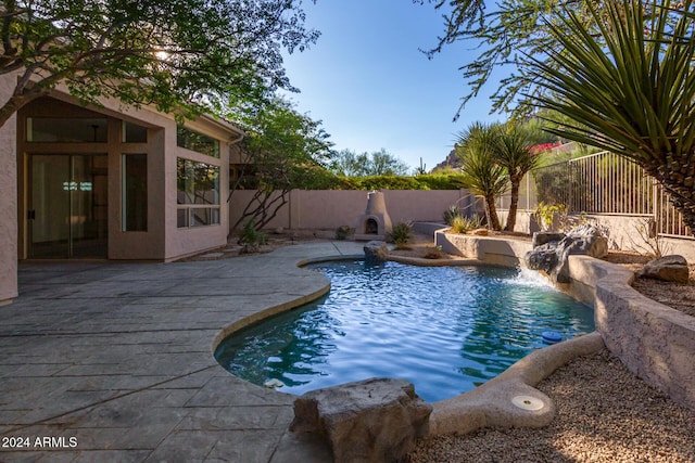 view of pool with a patio area, a fenced backyard, and a fenced in pool