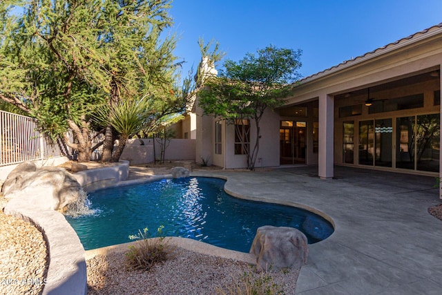 view of pool featuring a patio area, a fenced in pool, and a fenced backyard