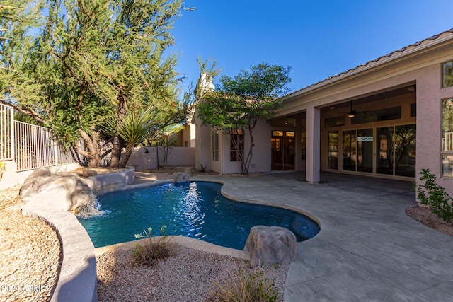 view of pool featuring a fenced backyard, ceiling fan, a patio, and a fenced in pool