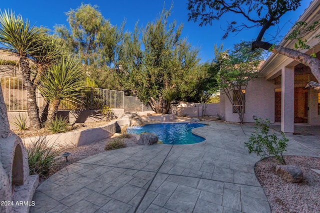 view of swimming pool with a fenced backyard, a patio, and a fenced in pool