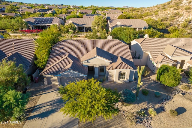 drone / aerial view with a mountain view and a residential view