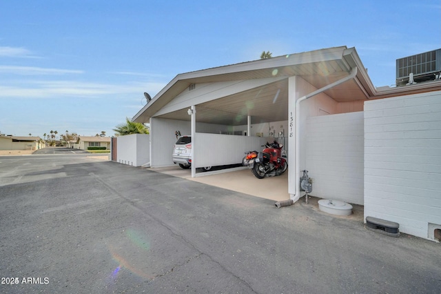 view of parking with a carport