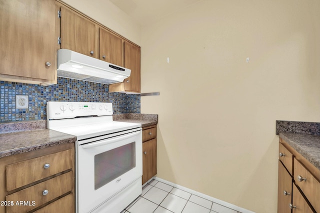 kitchen with tasteful backsplash, light tile patterned floors, and white range with electric cooktop