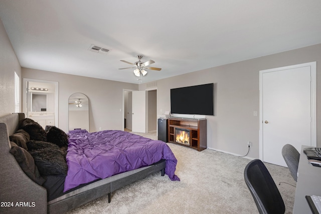 bedroom with ceiling fan and carpet floors