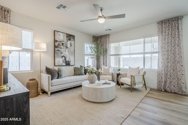 644 N Vine St, Chandler, AZ 85225 - living room featuring healthy amount of natural light, wood finished floors, a ceiling fan, and baseboards