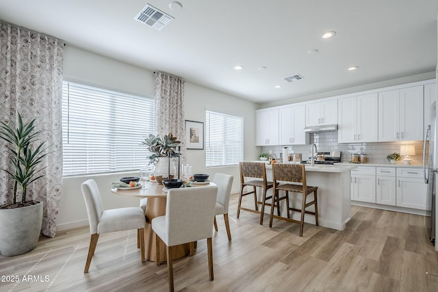 644 N Vine St, Chandler, AZ 85225 - dining space with recessed lighting, light wood-style floors, and baseboards