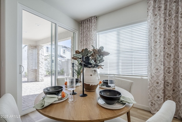 644 N Vine St, Chandler, AZ 85225 - dining room featuring plenty of natural light, wood finished floors, and baseboards