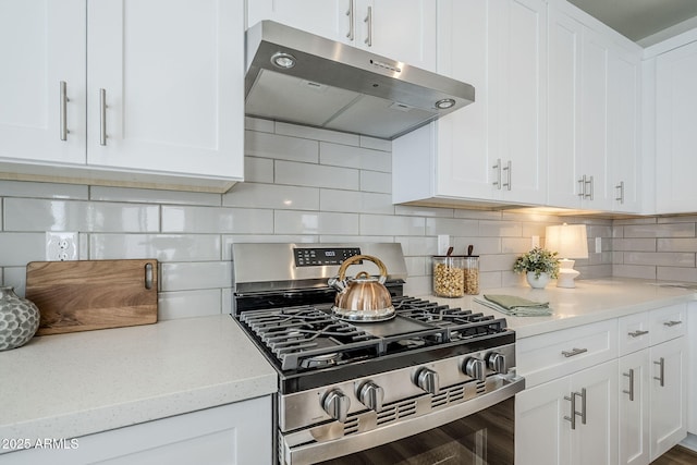 644 N Vine St, Chandler, AZ 85225 - kitchen featuring stainless steel range with gas stovetop, range hood, white cabinets, and decorative backsplash