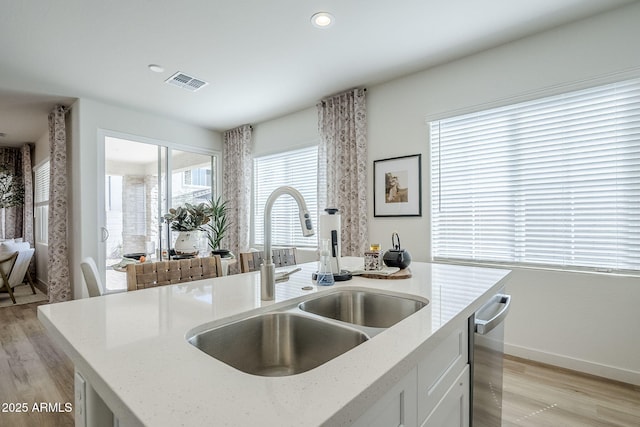 644 N Vine St, Chandler, AZ 85225 - kitchen with a sink, dishwasher, light wood-style floors, light stone countertops, and recessed lighting