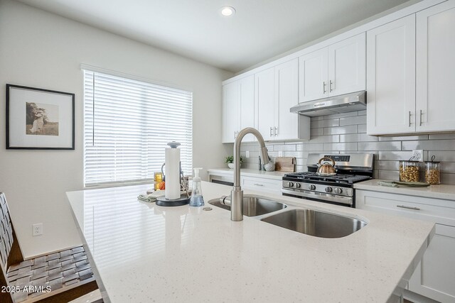 644 N Vine St, Chandler, AZ 85225 - kitchen featuring under cabinet range hood, stainless steel range with gas cooktop, decorative backsplash, light stone counters, and recessed lighting