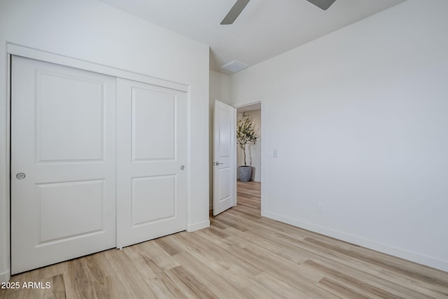 644 N Vine St, Chandler, AZ 85225 - unfurnished bedroom with wood finished floors, a closet, baseboards, and a ceiling fan