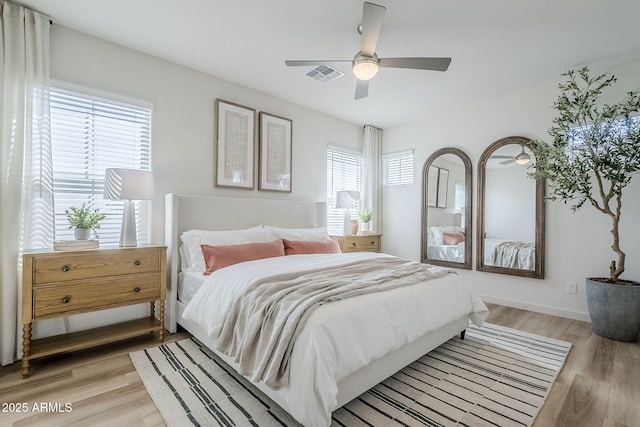 644 N Vine St, Chandler, AZ 85225 - bedroom with light wood-style floors and a ceiling fan