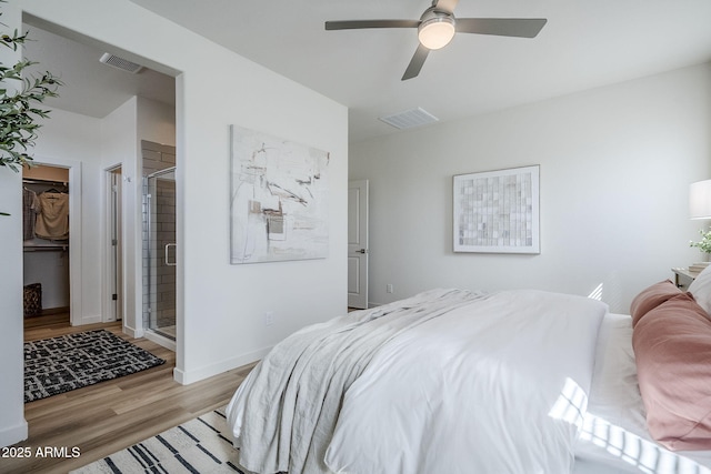 644 N Vine St, Chandler, AZ 85225 - bedroom with light wood-style flooring, a walk in closet, baseboards, connected bathroom, and a ceiling fan