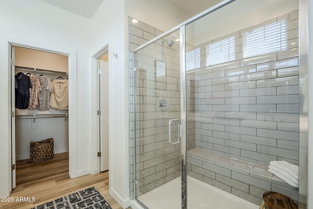 644 N Vine St, Chandler, AZ 85225 - bathroom with a stall shower, a spacious closet, wood finished floors, and baseboards