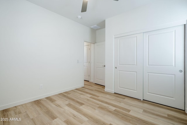 644 N Vine St, Chandler, AZ 85225 - unfurnished bedroom featuring light wood-style floors, a closet, a ceiling fan, and baseboards