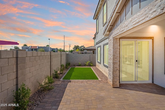 644 N Vine St, Chandler, AZ 85225 - patio terrace at dusk featuring a patio and a fenced backyard