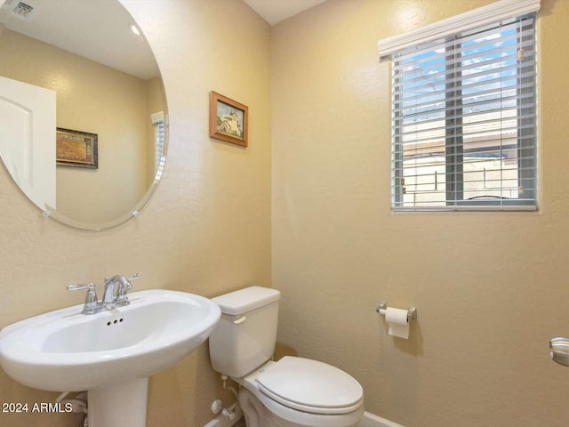 bathroom featuring sink and toilet