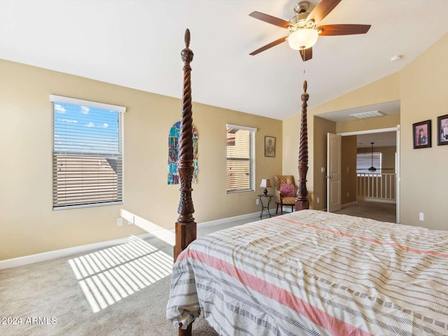 bedroom with ceiling fan, vaulted ceiling, and carpet floors