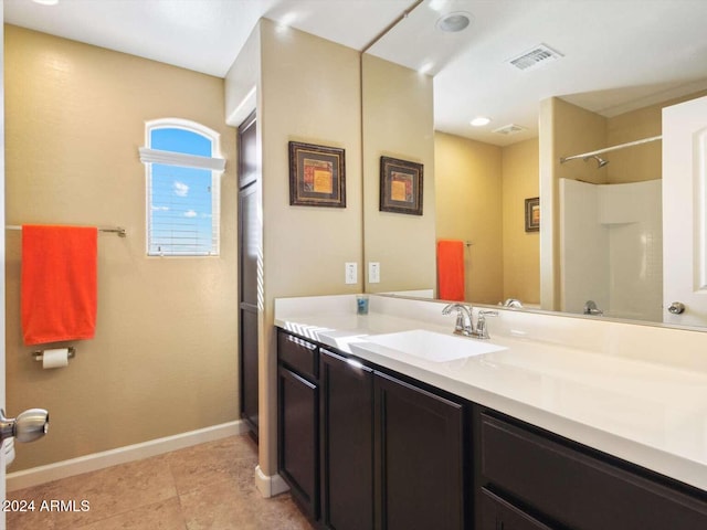 bathroom featuring vanity and tile patterned flooring