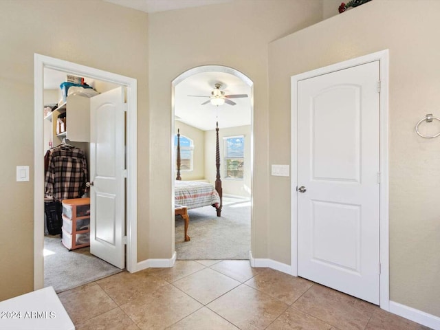 corridor with light tile patterned floors