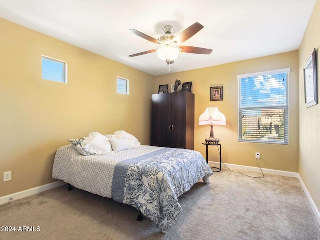 carpeted bedroom with ceiling fan