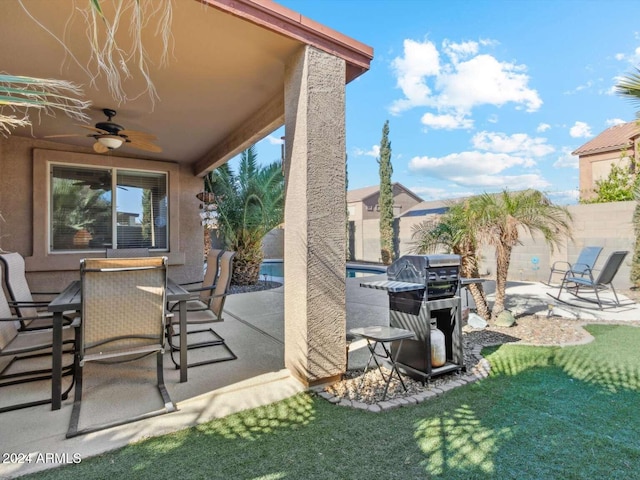 view of patio featuring ceiling fan and grilling area