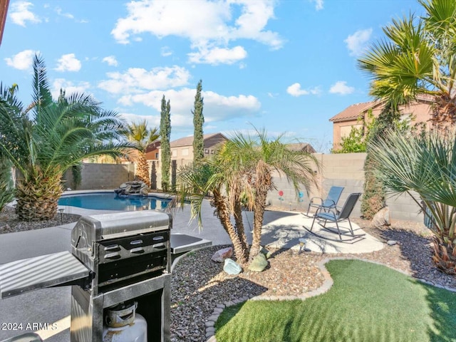 view of yard featuring a fenced in pool and a patio area