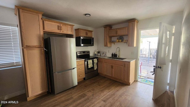 110 N Pinal Ave, Superior, AZ 85173 - kitchen with wood-type flooring, appliances with stainless steel finishes, and sink