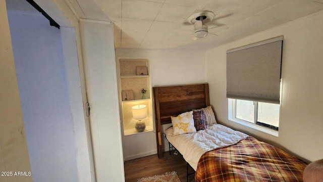 110 N Pinal Ave, Superior, AZ 85173 - bedroom with ceiling fan and dark wood-type flooring