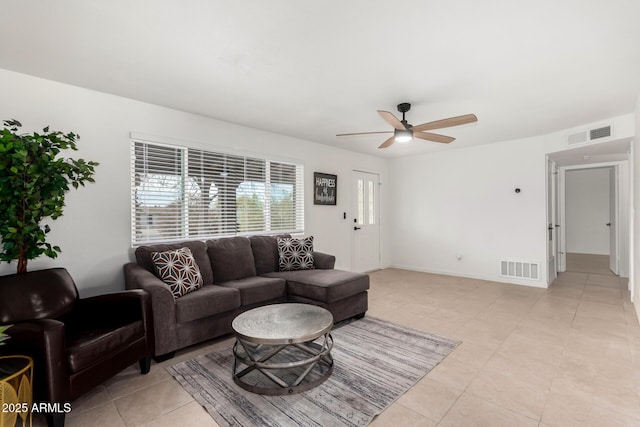 living room with light tile patterned flooring and ceiling fan