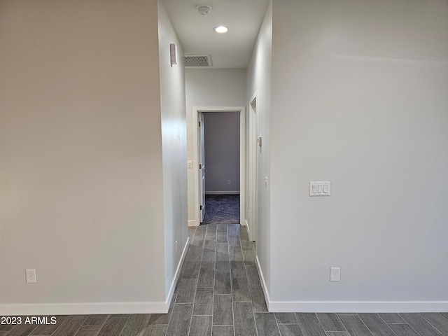 corridor featuring dark hardwood / wood-style floors