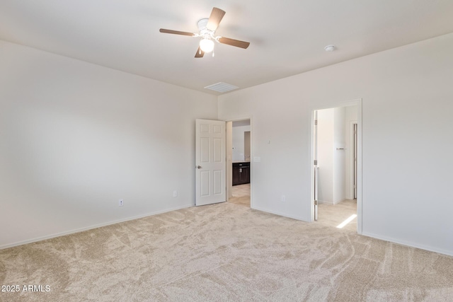 unfurnished bedroom featuring ceiling fan and light colored carpet