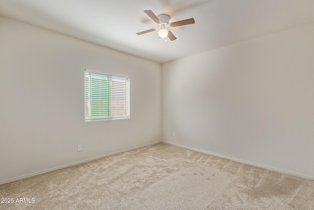 unfurnished room with ceiling fan and light colored carpet