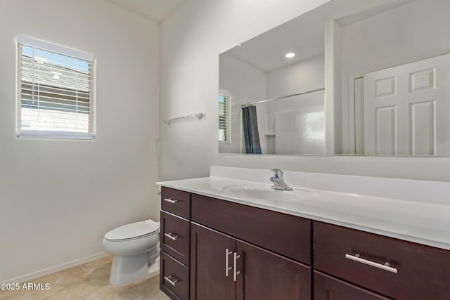 bathroom featuring tile patterned floors, vanity, toilet, and curtained shower