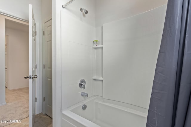 bathroom featuring tile patterned flooring and shower / tub combo with curtain