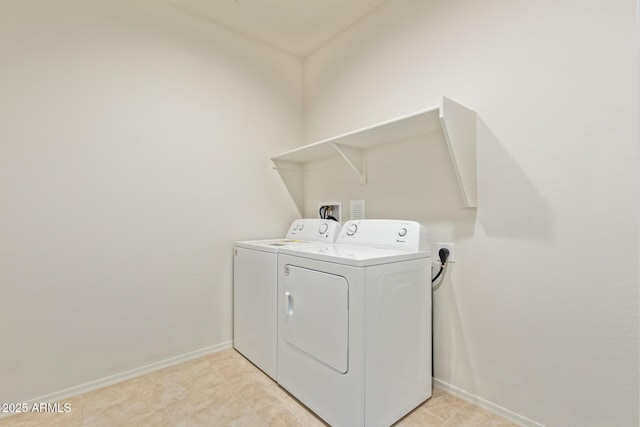 laundry area featuring washing machine and dryer