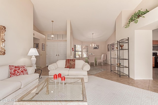 living room with light tile patterned flooring, lofted ceiling, and a chandelier