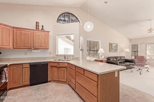 kitchen with sink, decorative light fixtures, light tile patterned floors, black dishwasher, and kitchen peninsula