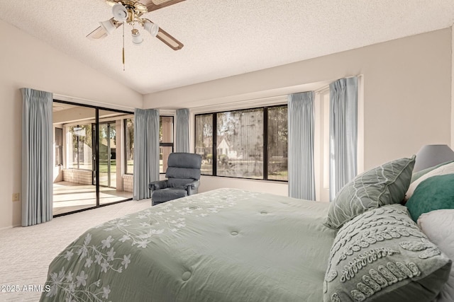 bedroom featuring lofted ceiling, access to exterior, carpet, and a textured ceiling