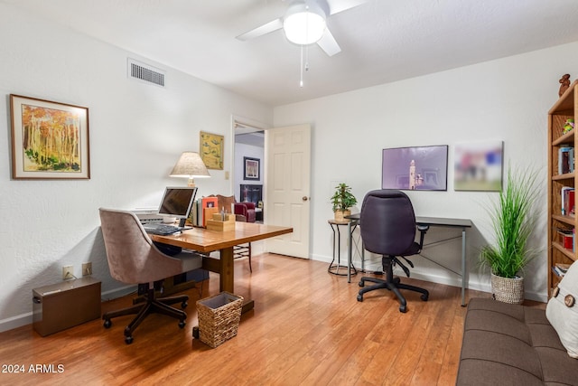 office space with hardwood / wood-style flooring and ceiling fan