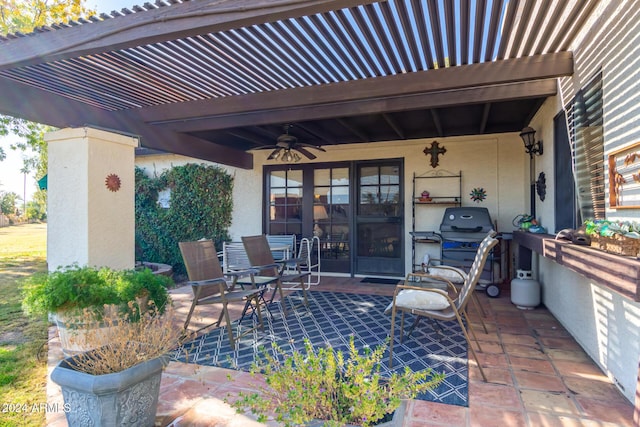 view of patio / terrace with ceiling fan and a pergola