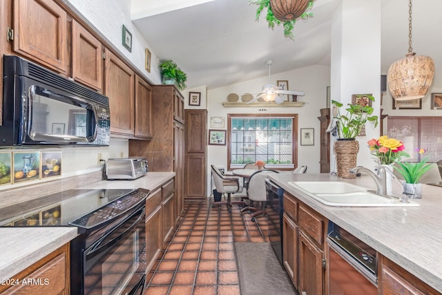 kitchen featuring hanging light fixtures, lofted ceiling, sink, and black appliances