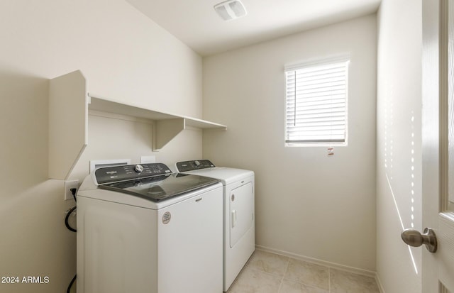 clothes washing area featuring washer and dryer